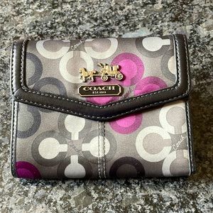 Previously used Coach tri-fold wallet.